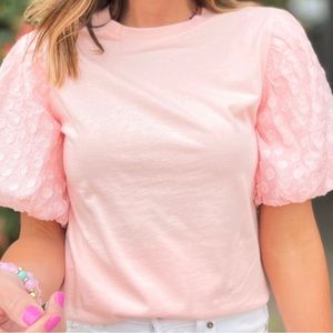 Light pink shirt with polka dot puff sleeves